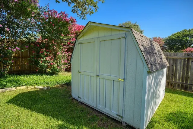 a view of swimming pool of lake and residential houses with outdoor space