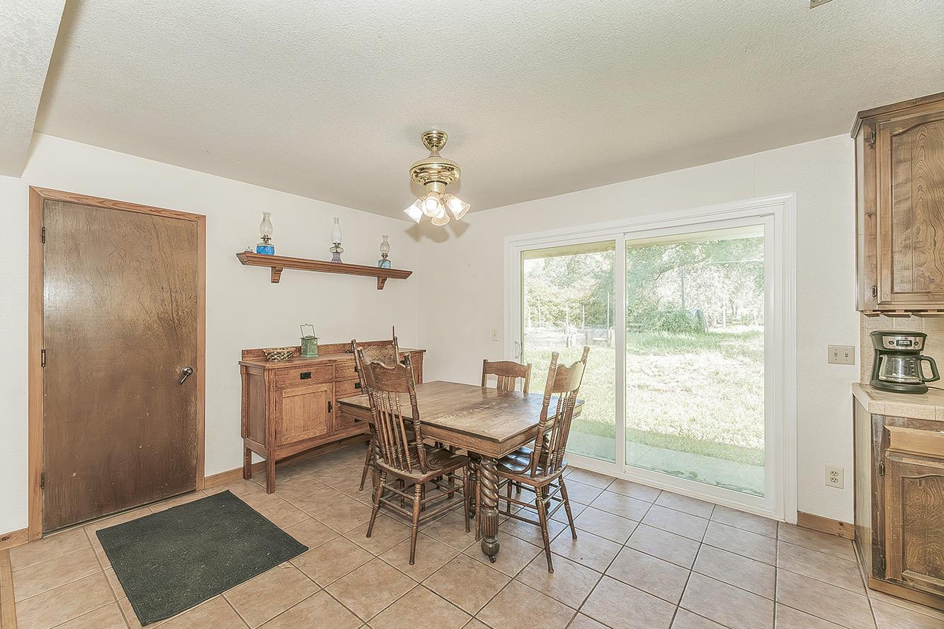 26045 Pittman Hill Road Clovis, CA 93619 - Photo 18 of 93 a view of a dining room with furniture and a chandelier