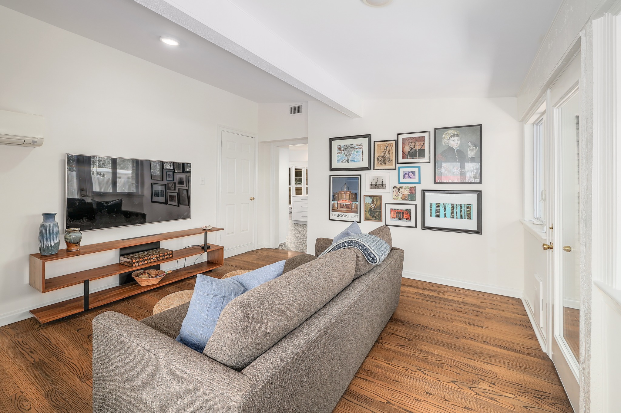 5600 Bull Creek Road Austin, TX 78756 - Photo 12 of 33 a living room with furniture and a flat screen tv