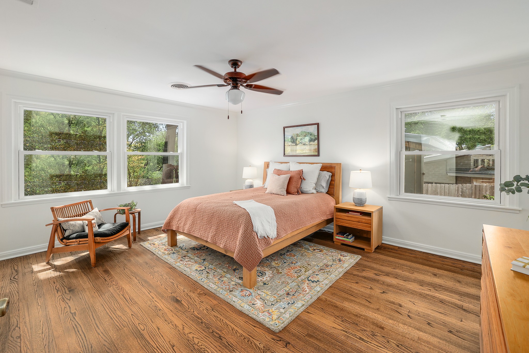 5600 Bull Creek Road Austin, TX 78756 - Photo 14 of 33 a bedroom with a bed a large window with chair and window