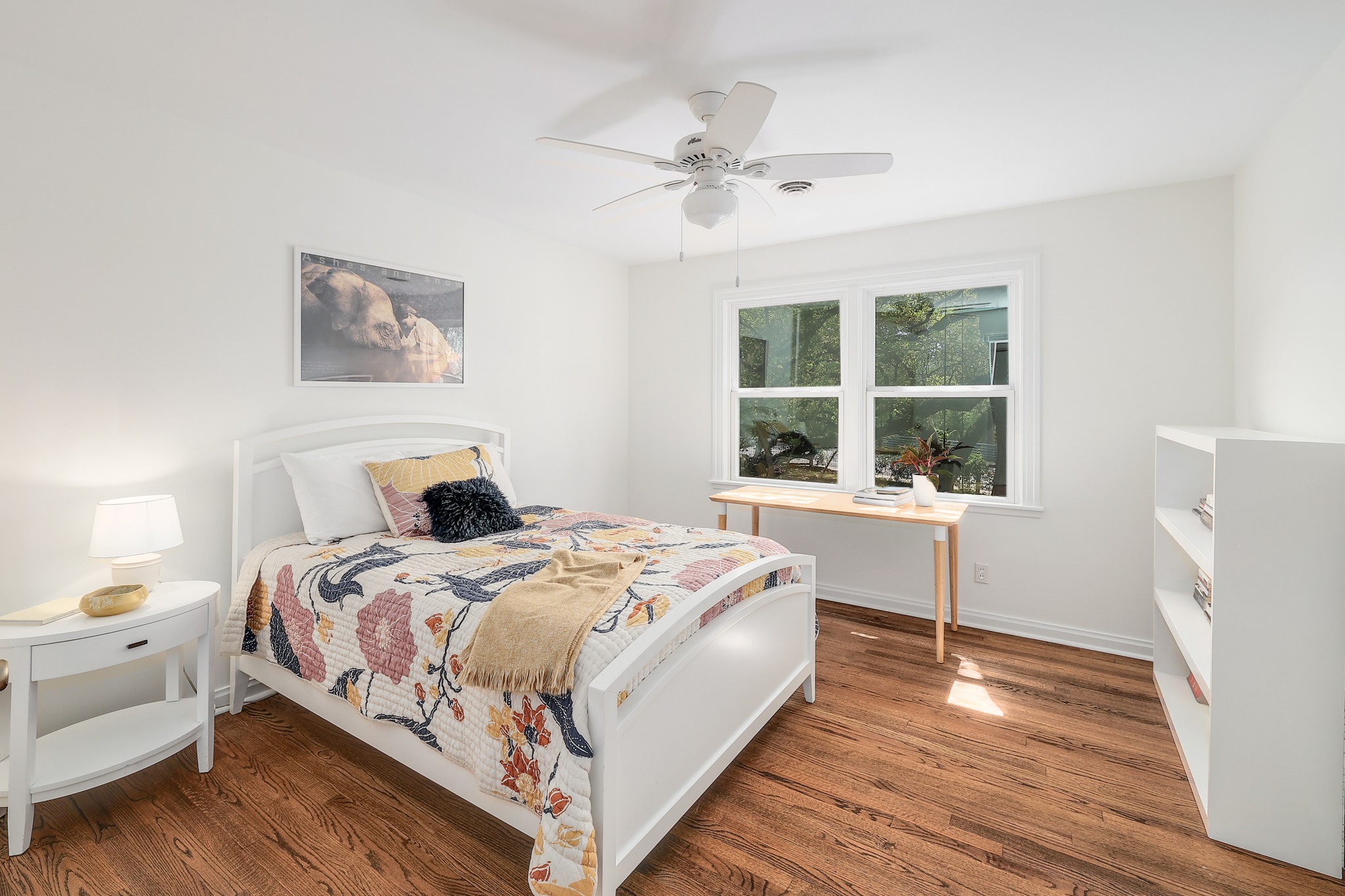 5600 Bull Creek Road Austin, TX 78756 - Photo 18 of 33 a bedroom with a bed and a large window