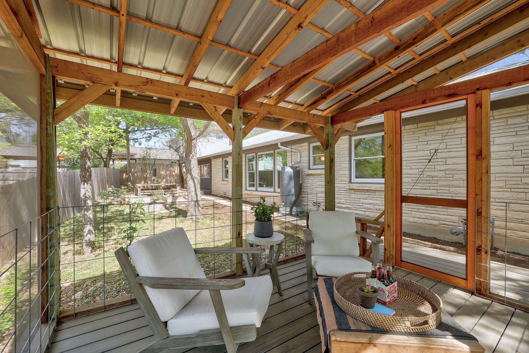 5600 Bull Creek Road Austin, TX 78756 - Photo 25 of 33 a view of a patio with table and chairs and wooden floor