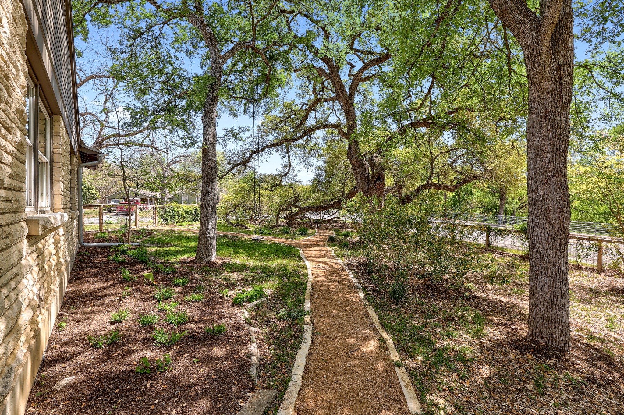 5600 Bull Creek Road Austin, TX 78756 - Photo 26 of 33 a view of a yard with plants and trees