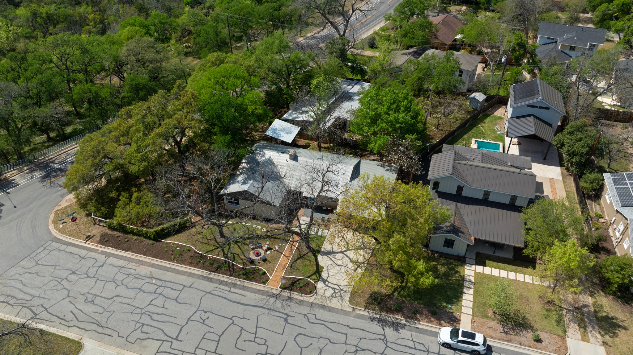 5600 Bull Creek Road Austin, TX 78756 - Photo 28 of 33 an aerial view of a house with a yard and large trees