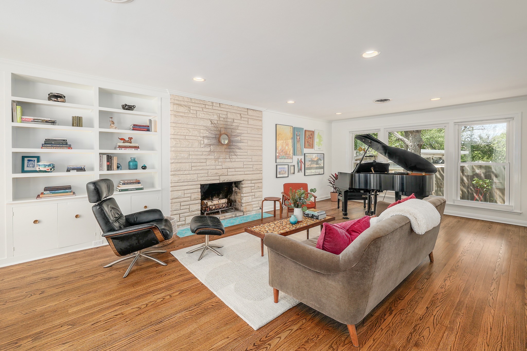 5600 Bull Creek Road Austin, TX 78756 - Photo 3 of 33 a living room with furniture or couch and a fireplace