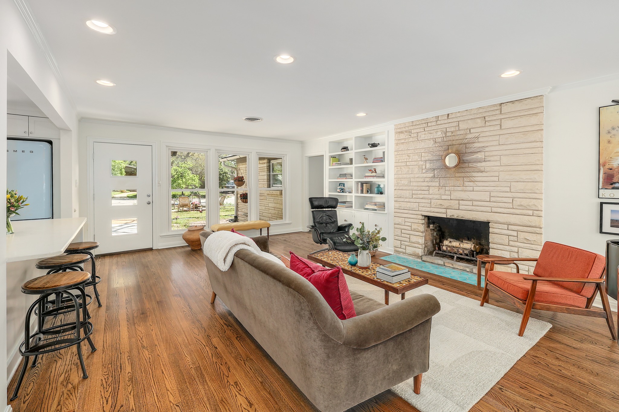 5600 Bull Creek Road Austin, TX 78756 - Photo 4 of 33 a living room with furniture and a fireplace