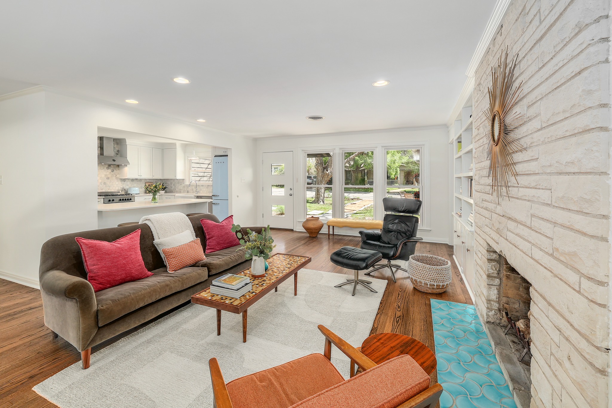 5600 Bull Creek Road Austin, TX 78756 - Photo 5 of 33 a living room with furniture fireplace and a large window