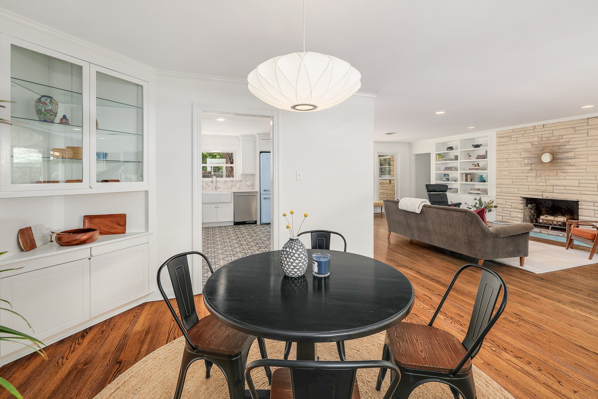 5600 Bull Creek Road Austin, TX 78756 - Photo 8 of 33 a view of a dining room with furniture and wooden floor