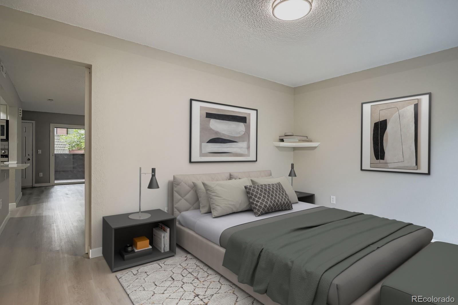 3050 West 32nd Avenue, Unit 102C Denver, CO 80211 - Photo 15 of 36 a bedroom with a bed and a painting on the wall