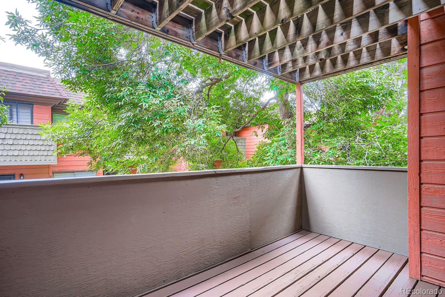3050 West 32nd Avenue, Unit 102C Denver, CO 80211 - Photo 19 of 36 a view of a balcony with wooden floor