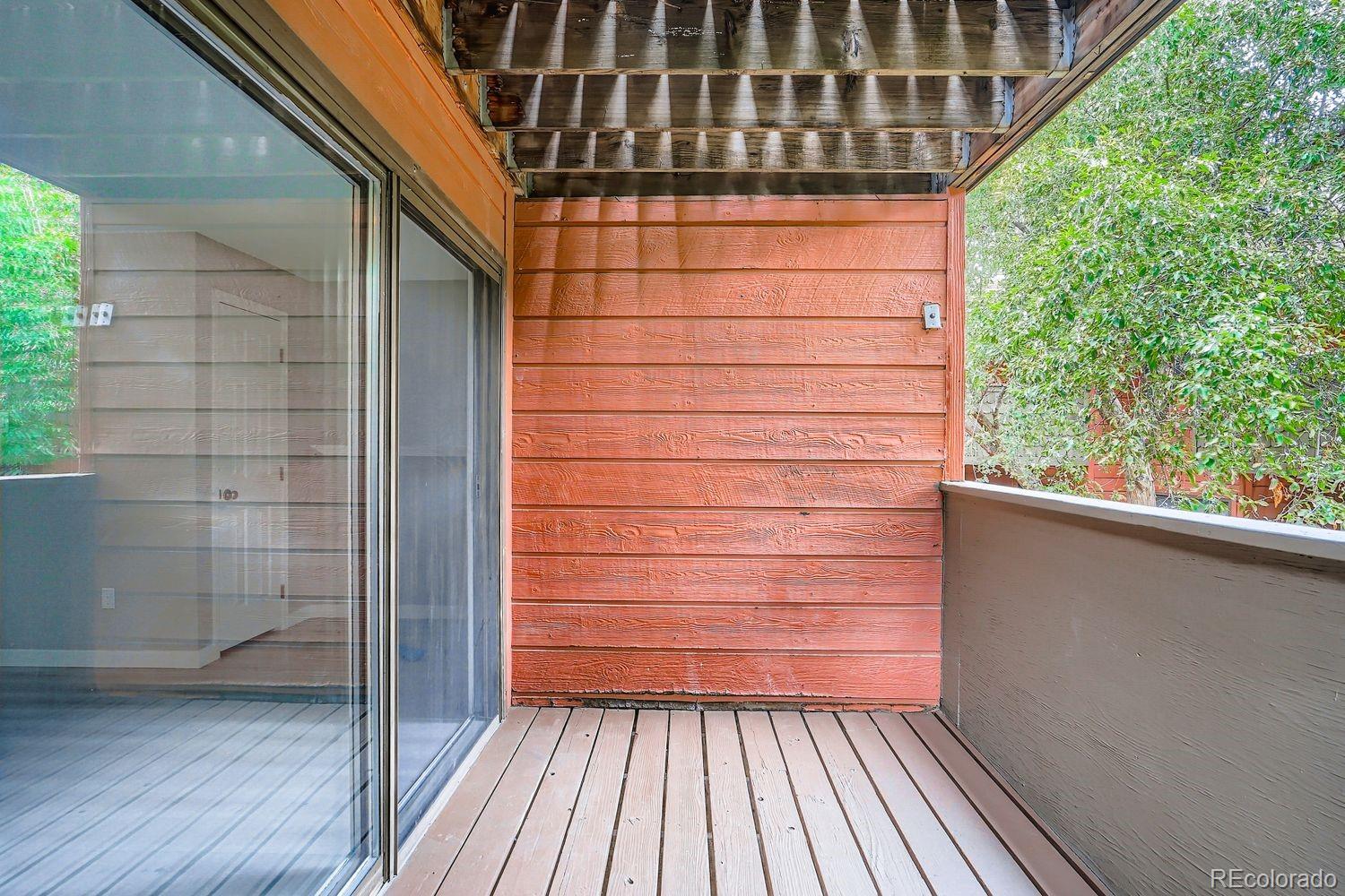 3050 West 32nd Avenue, Unit 102C Denver, CO 80211 - Photo 20 of 36 a view of wooden balcony