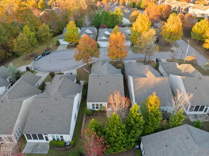 a view of a house with swimming pool and sitting area