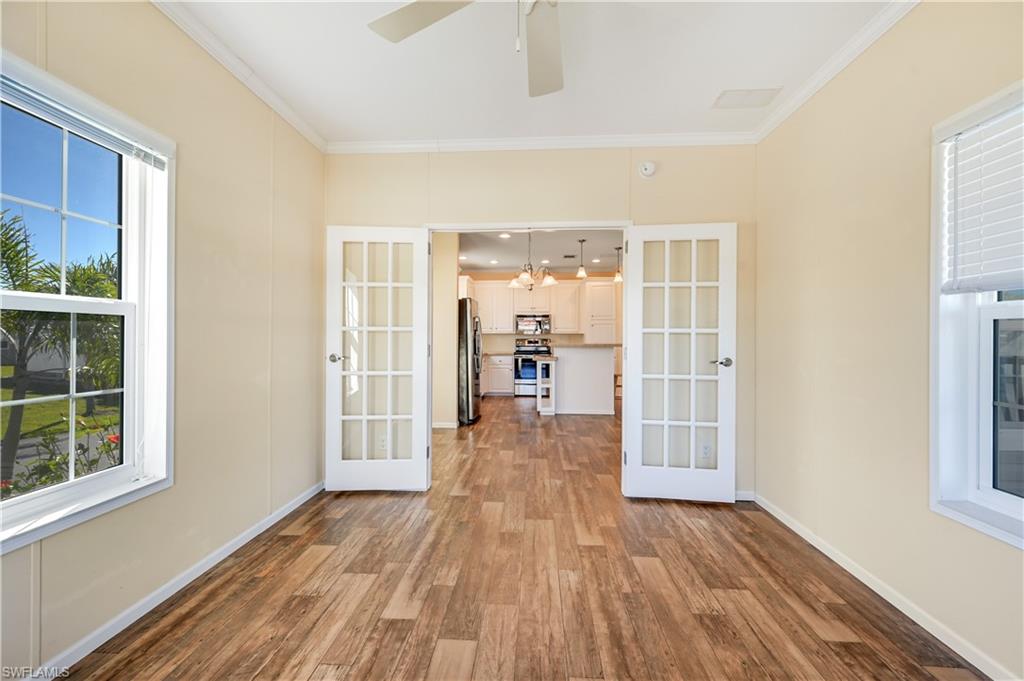22 Enchanting Boulevard, Unit E22 Naples, FL 34112 - Photo 16 of 20 wooden floor in an empty room