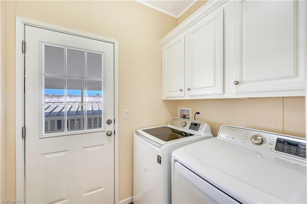 22 Enchanting Boulevard, Unit E22 Naples, FL 34112 - Photo 18 of 20 a utility room with dryer and washer