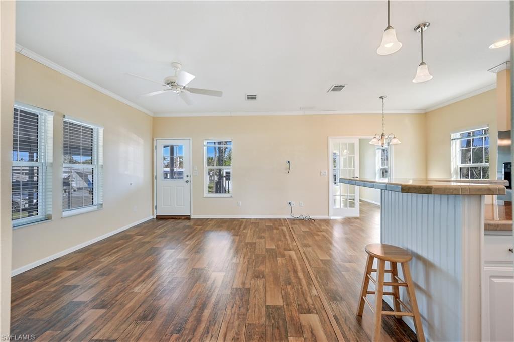 22 Enchanting Boulevard, Unit E22 Naples, FL 34112 - Photo 2 of 20 a view of a livingroom with wooden floor
