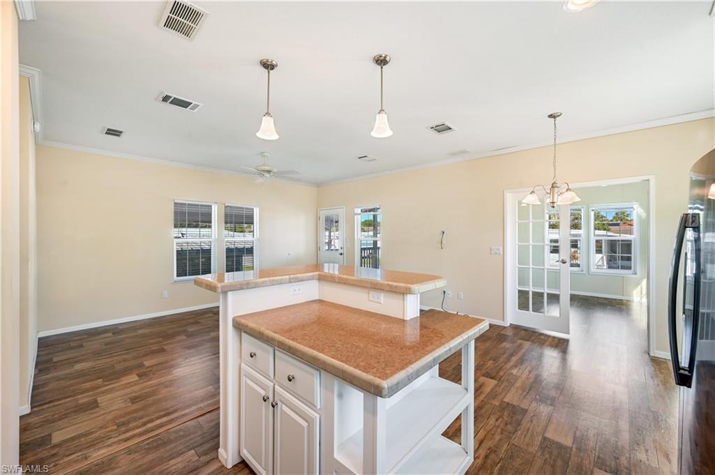22 Enchanting Boulevard, Unit E22 Naples, FL 34112 - Photo 8 of 20 a view of kitchen and windows