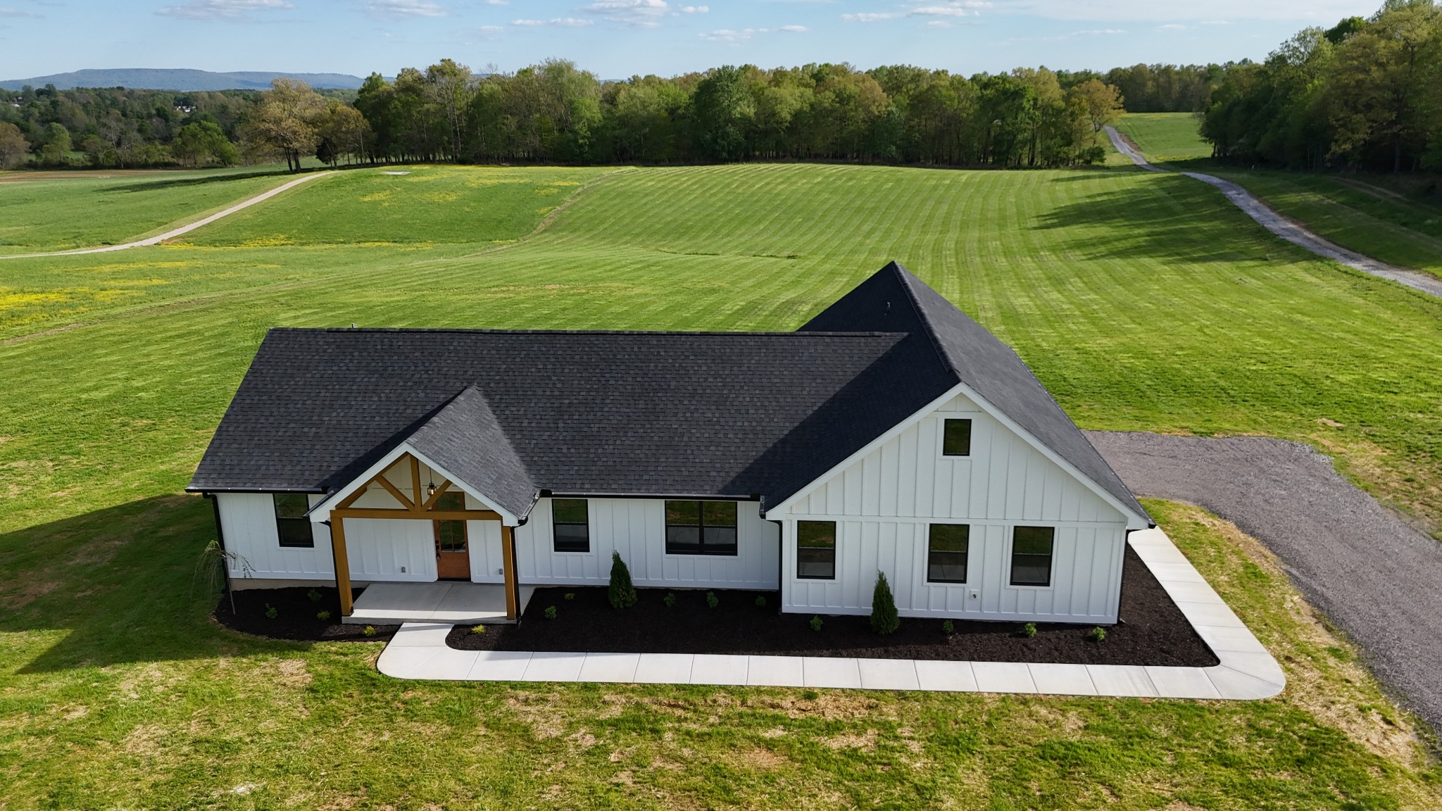a aerial view of a house with a yard