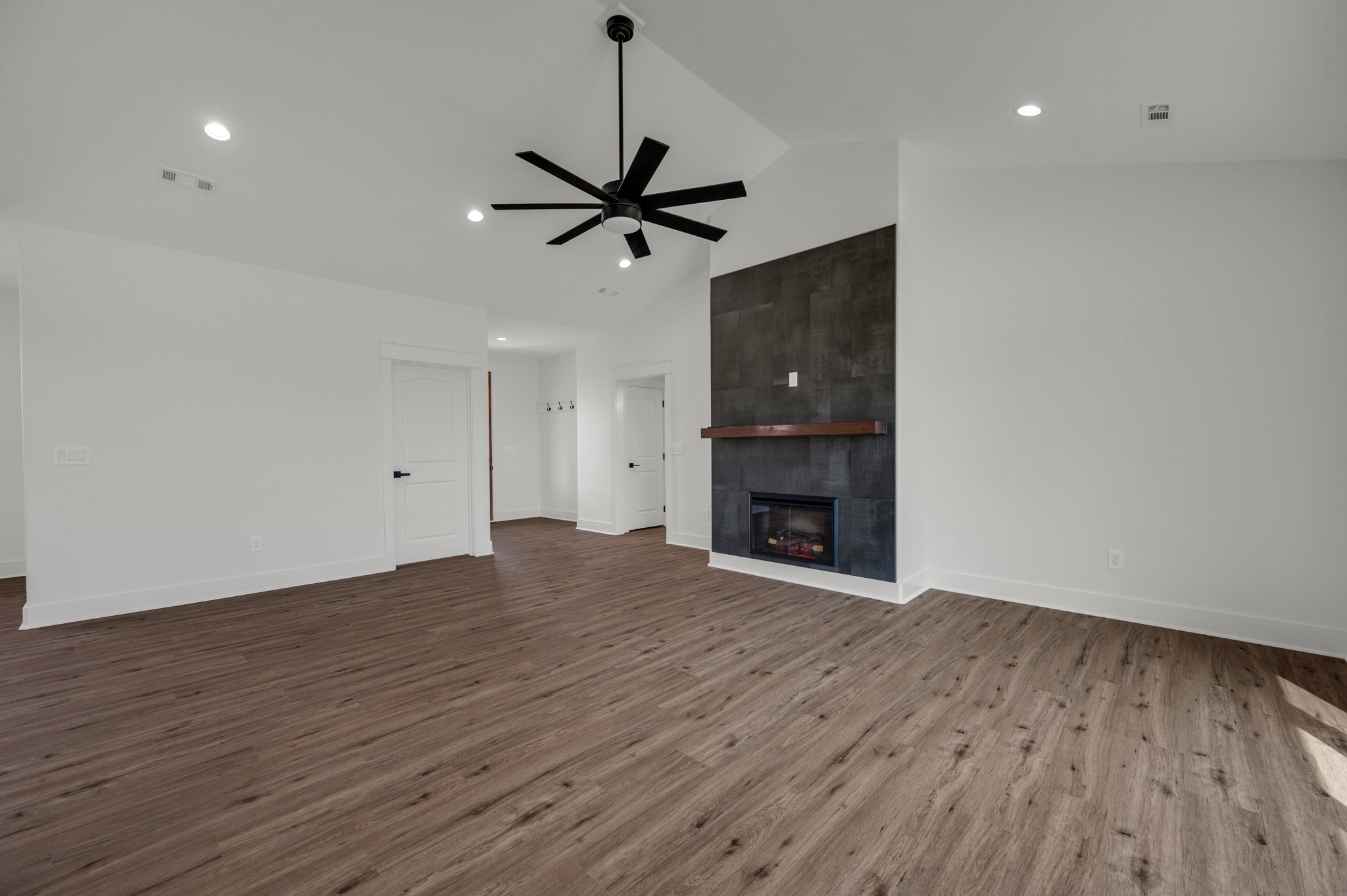 625 Robert Smith Road McMinnville, TN 37110 - Photo 21 of 40 a view of empty room with wooden floor and fireplace