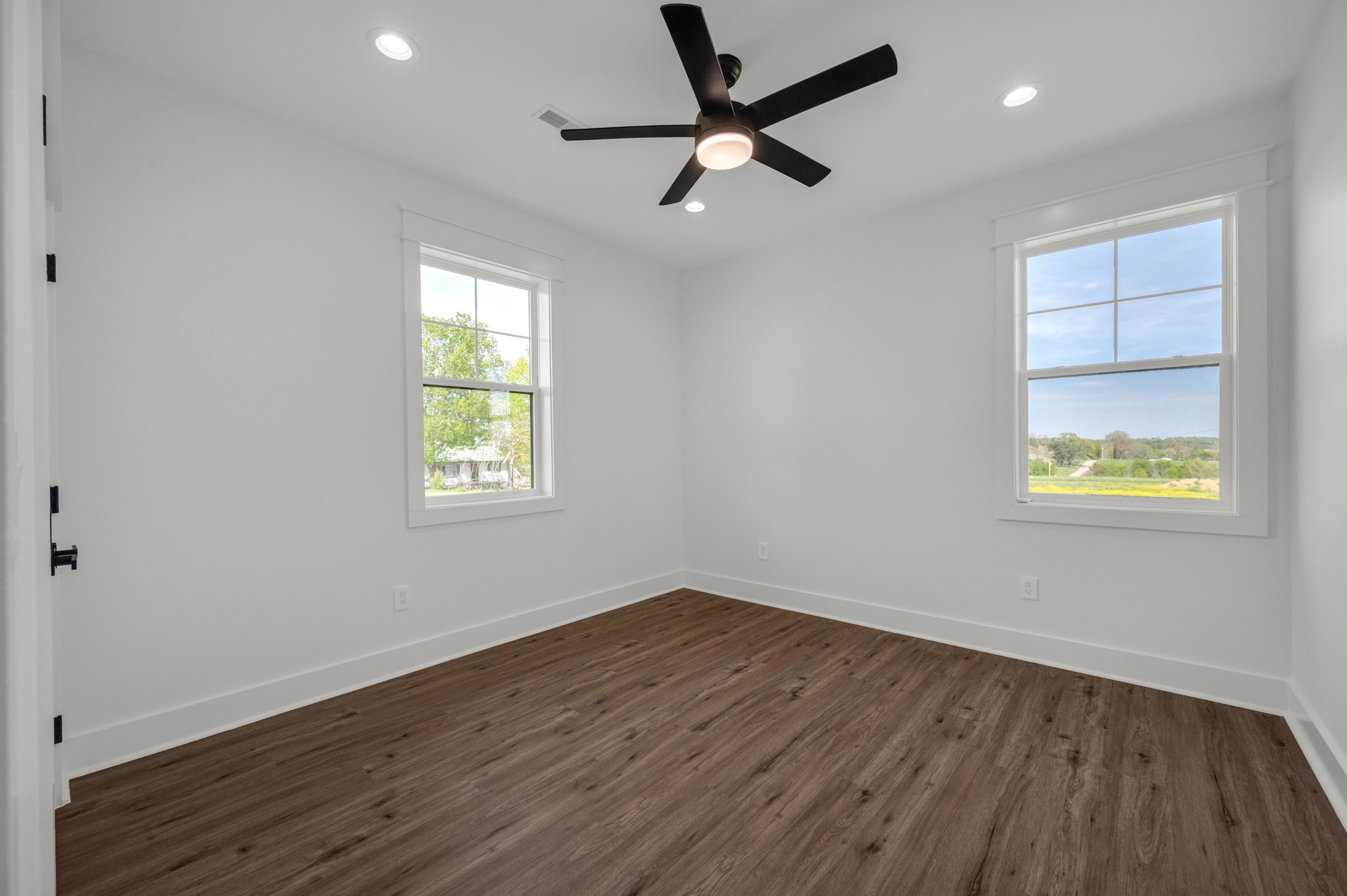 625 Robert Smith Road McMinnville, TN 37110 - Photo 23 of 40 an empty room with wooden floor and windows