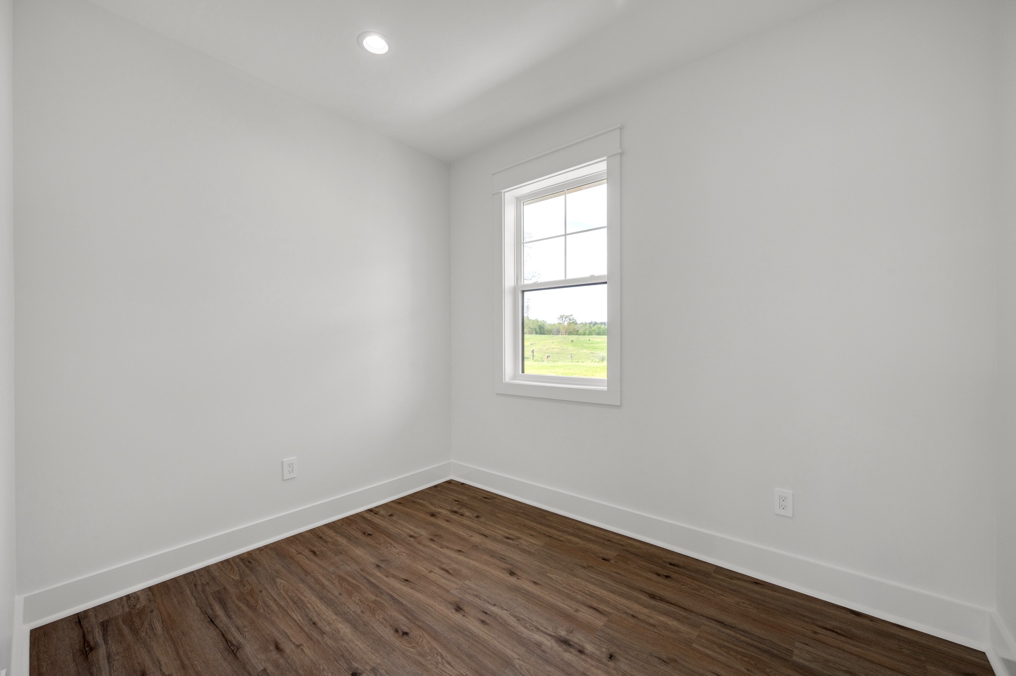 625 Robert Smith Road McMinnville, TN 37110 - Photo 24 of 40 an empty room with wooden floor and windows