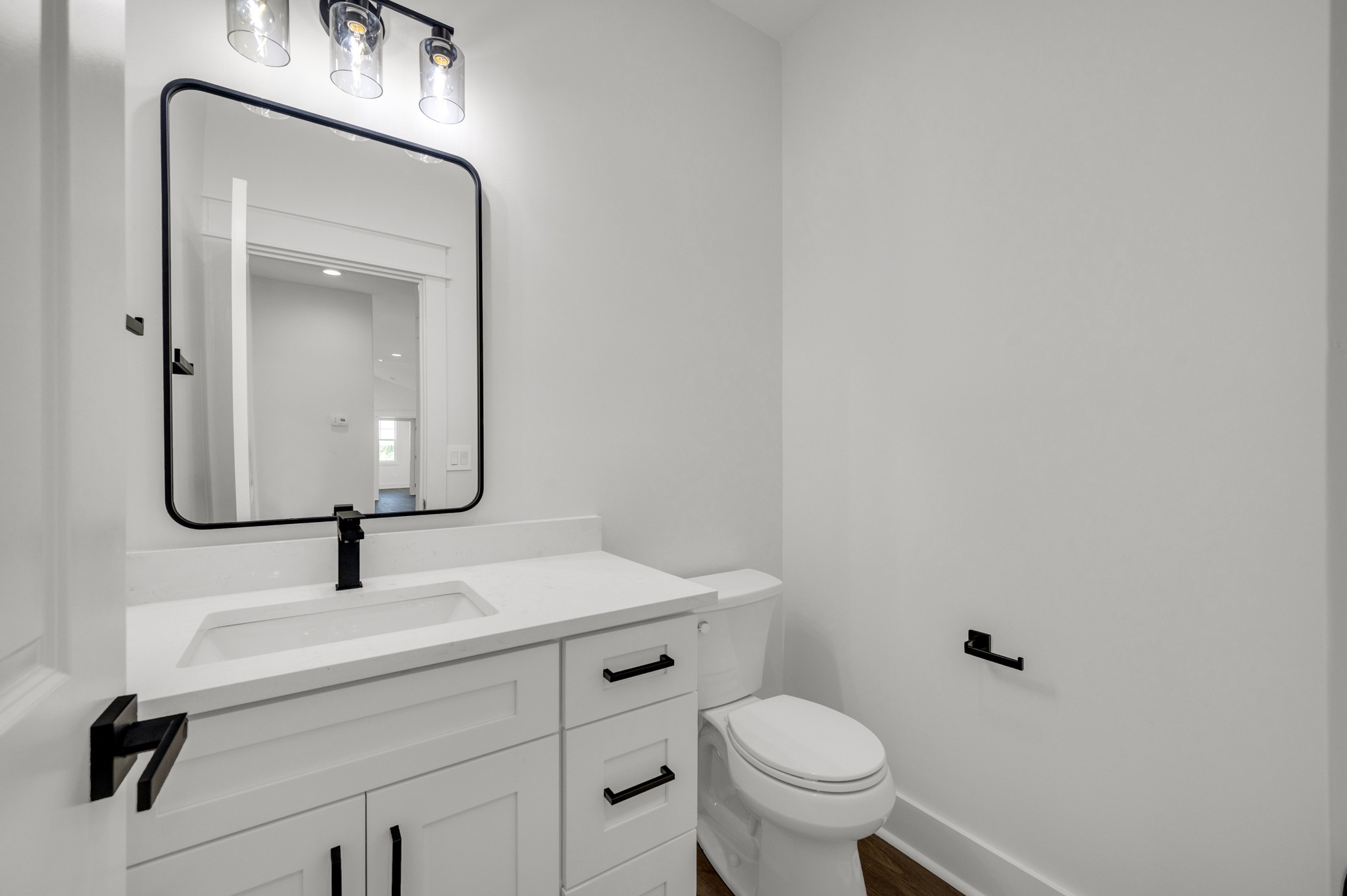 625 Robert Smith Road McMinnville, TN 37110 - Photo 29 of 40 a bathroom with a toilet a sink and mirror