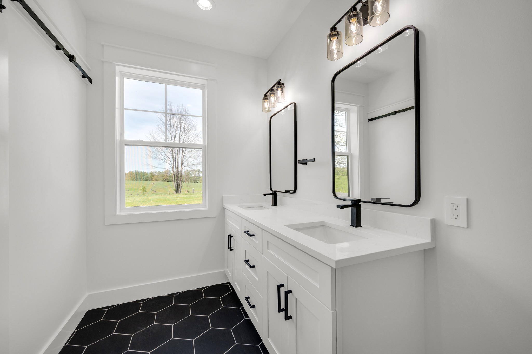 625 Robert Smith Road McMinnville, TN 37110 - Photo 33 of 40 a bathroom with double vanity sink and a mirror