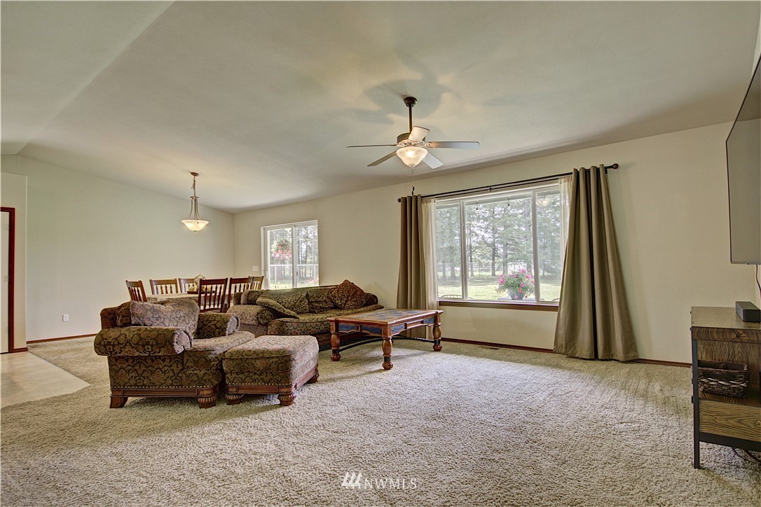 5138 180th Trail Southwest Rochester, WA 98579 - Photo 2 of 33 a living room with furniture and a window