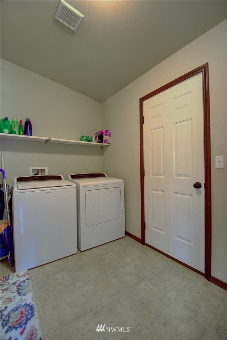 5138 180th Trail Southwest Rochester, WA 98579 - Photo 12 of 33 a utility room with dryer and washer