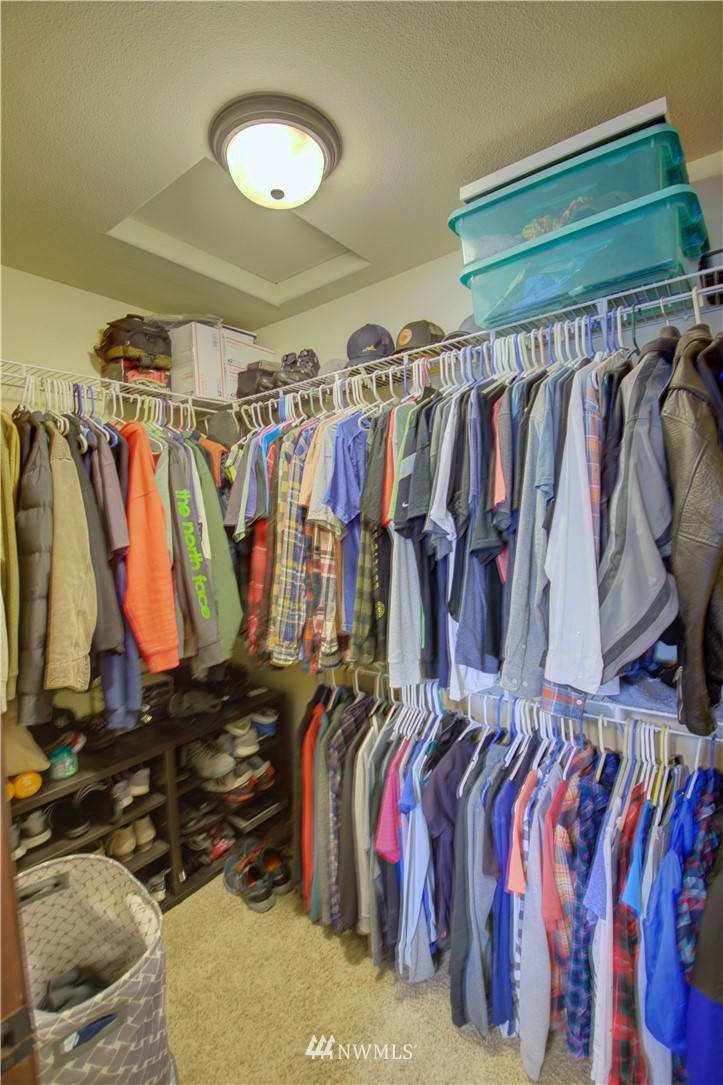 5138 180th Trail Southwest Rochester, WA 98579 - Photo 16 of 33 a view of walk in closet with clothes and shoes