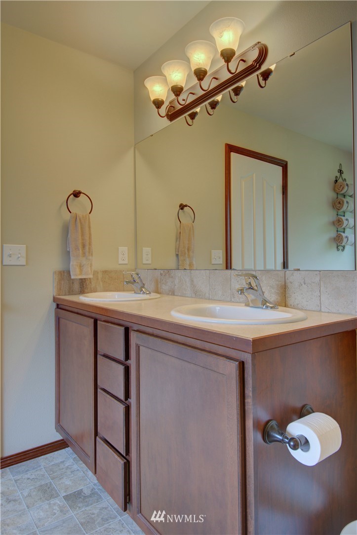 5138 180th Trail Southwest Rochester, WA 98579 - Photo 19 of 33 a bathroom with a sink and a mirror