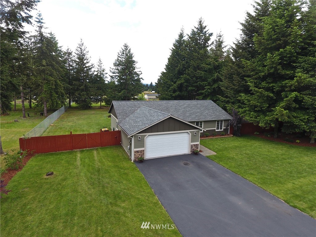 5138 180th Trail Southwest Rochester, WA 98579 - Photo 32 of 33 a house with garden in front of it