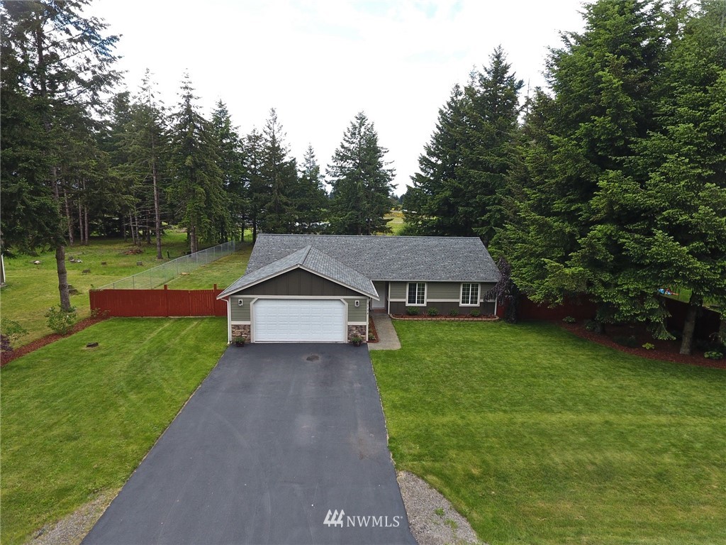 5138 180th Trail Southwest Rochester, WA 98579 - Photo 33 of 33 a view of a house with yard and a garden