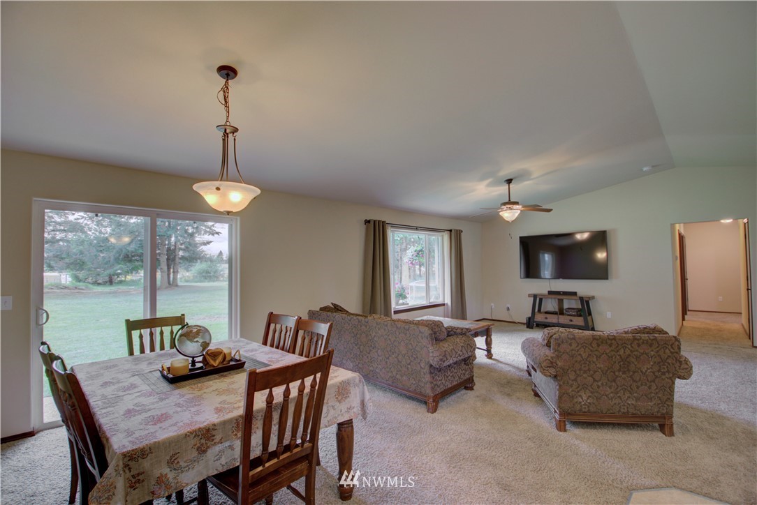 5138 180th Trail Southwest Rochester, WA 98579 - Photo 6 of 33 a view of a dining room with furniture window and outside view