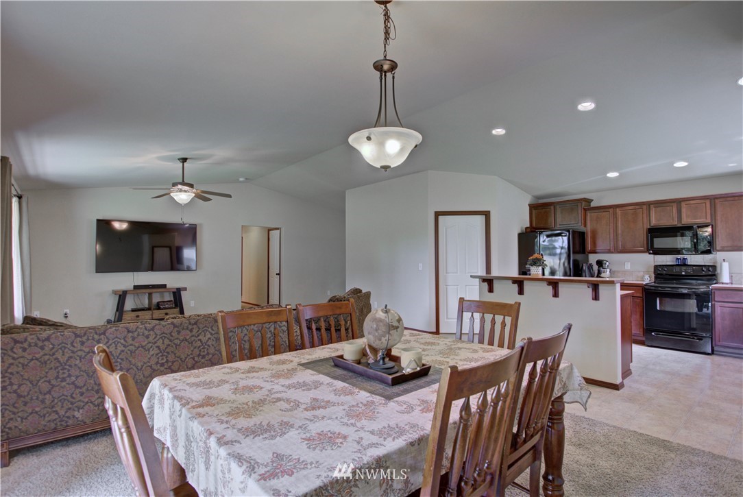 5138 180th Trail Southwest Rochester, WA 98579 - Photo 7 of 33 a view of a dining room with furniture
