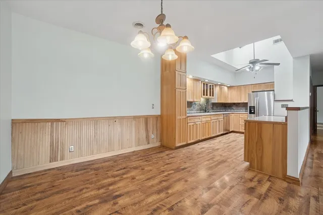 a view of kitchen with wooden floor