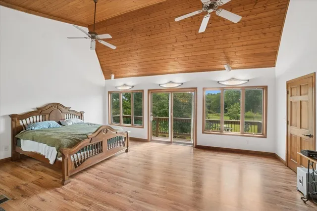 a bedroom with furniture and a fireplace