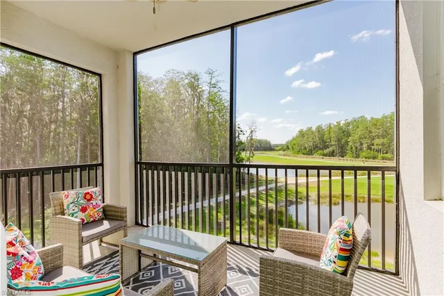 a balcony with furniture and garden view