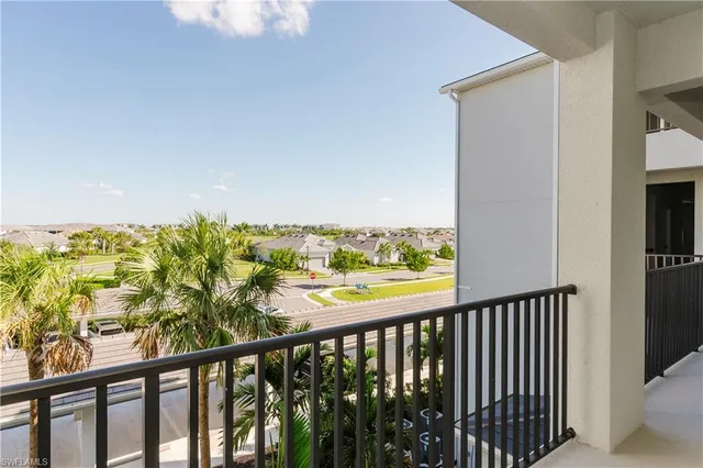 a view of a balcony with wooden floor and outdoor space