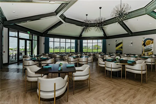 a view of a dining room with furniture window and outside view
