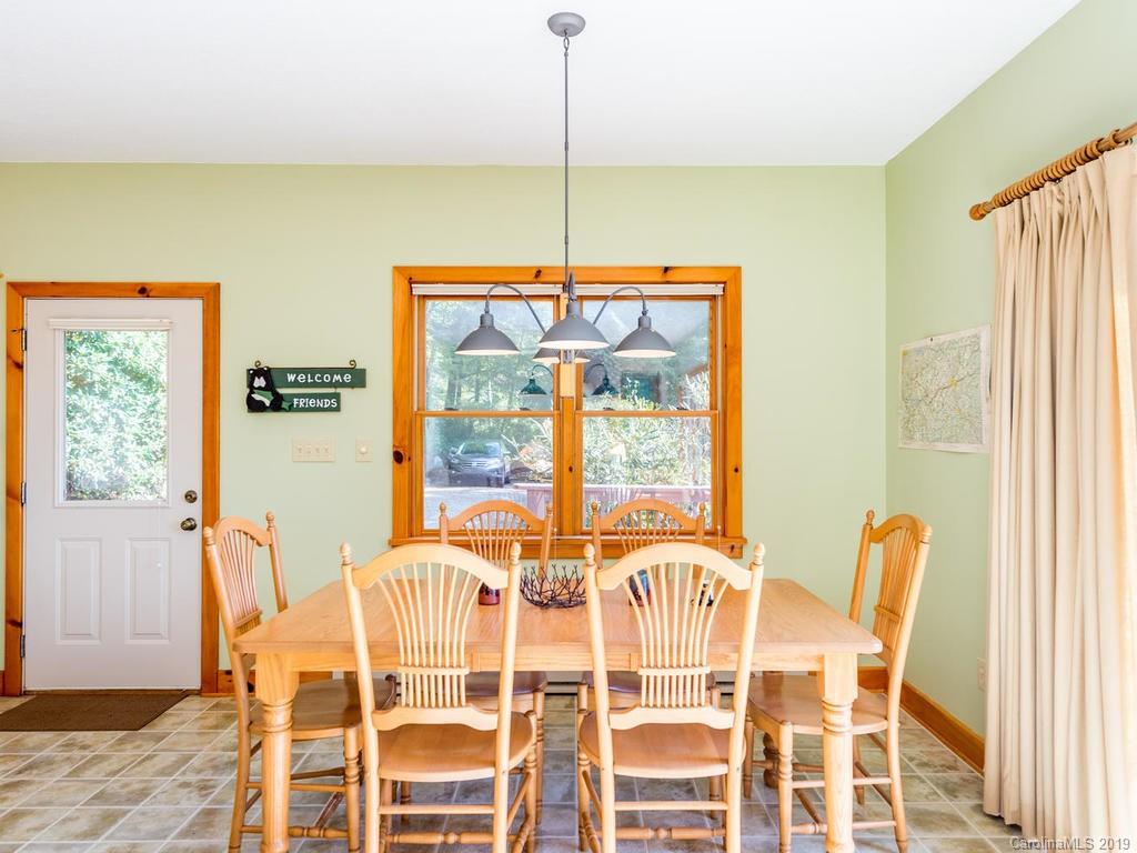 1299 Pine Ridge Road Burnsville, NC 28714 - Photo 12 of 41 a dining room with furniture and window
