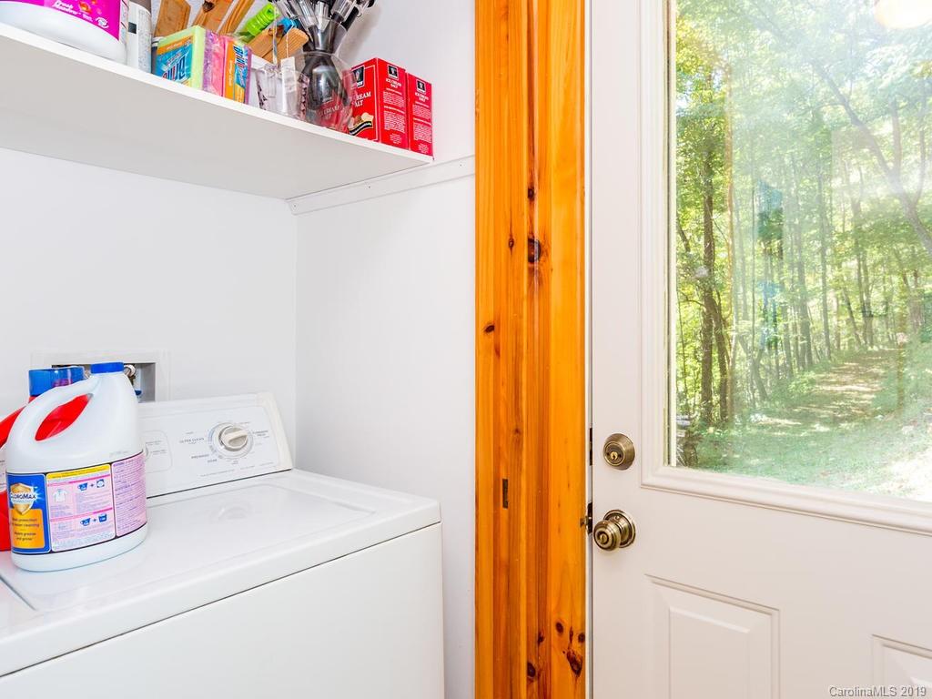 1299 Pine Ridge Road Burnsville, NC 28714 - Photo 19 of 41 a utility room with dryer and washer