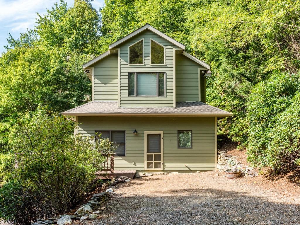 1299 Pine Ridge Road Burnsville, NC 28714 - Photo 29 of 41 a front view of a house with garden
