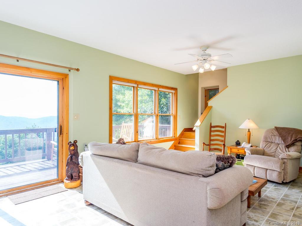 1299 Pine Ridge Road Burnsville, NC 28714 - Photo 5 of 41 a living room with furniture and a large window