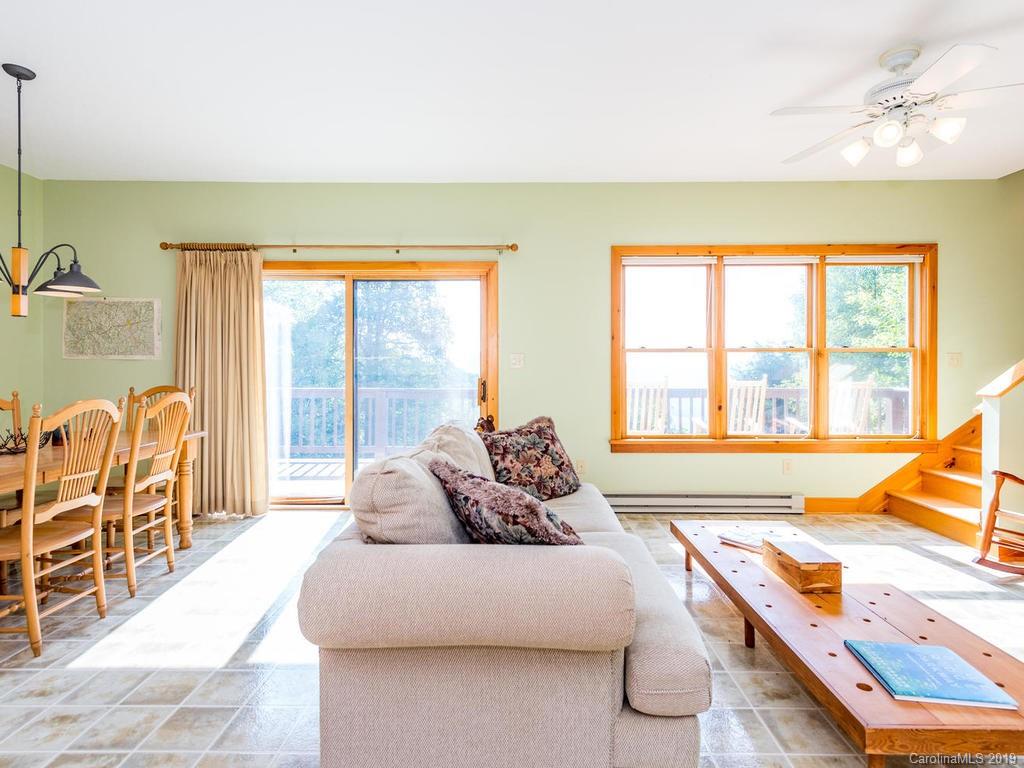 1299 Pine Ridge Road Burnsville, NC 28714 - Photo 6 of 41 a living room with furniture and a large window
