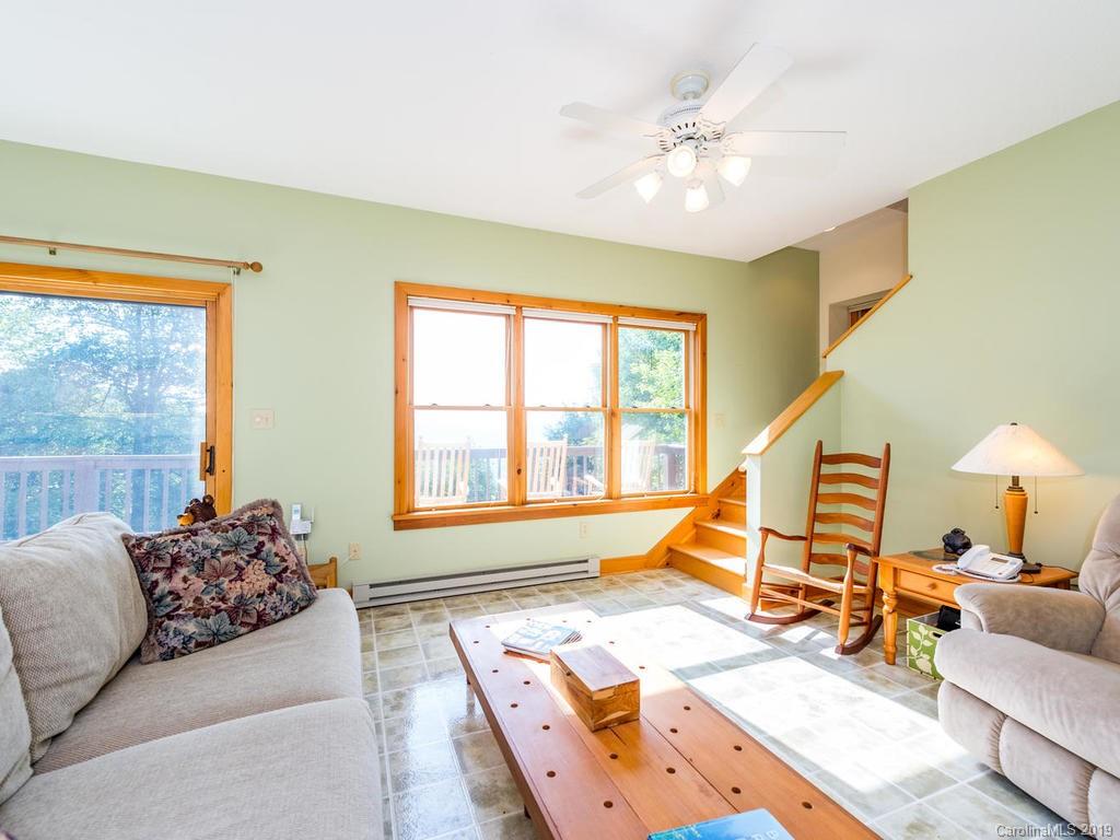 1299 Pine Ridge Road Burnsville, NC 28714 - Photo 7 of 41 a living room with furniture and a large window