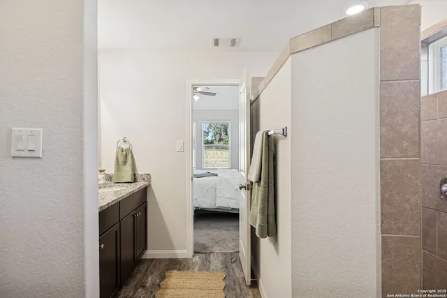 a view of a bedroom from a hallway