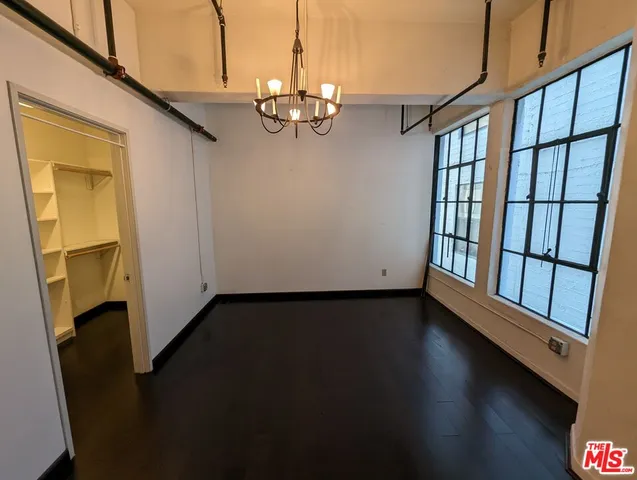 a view of gallery with wooden floor