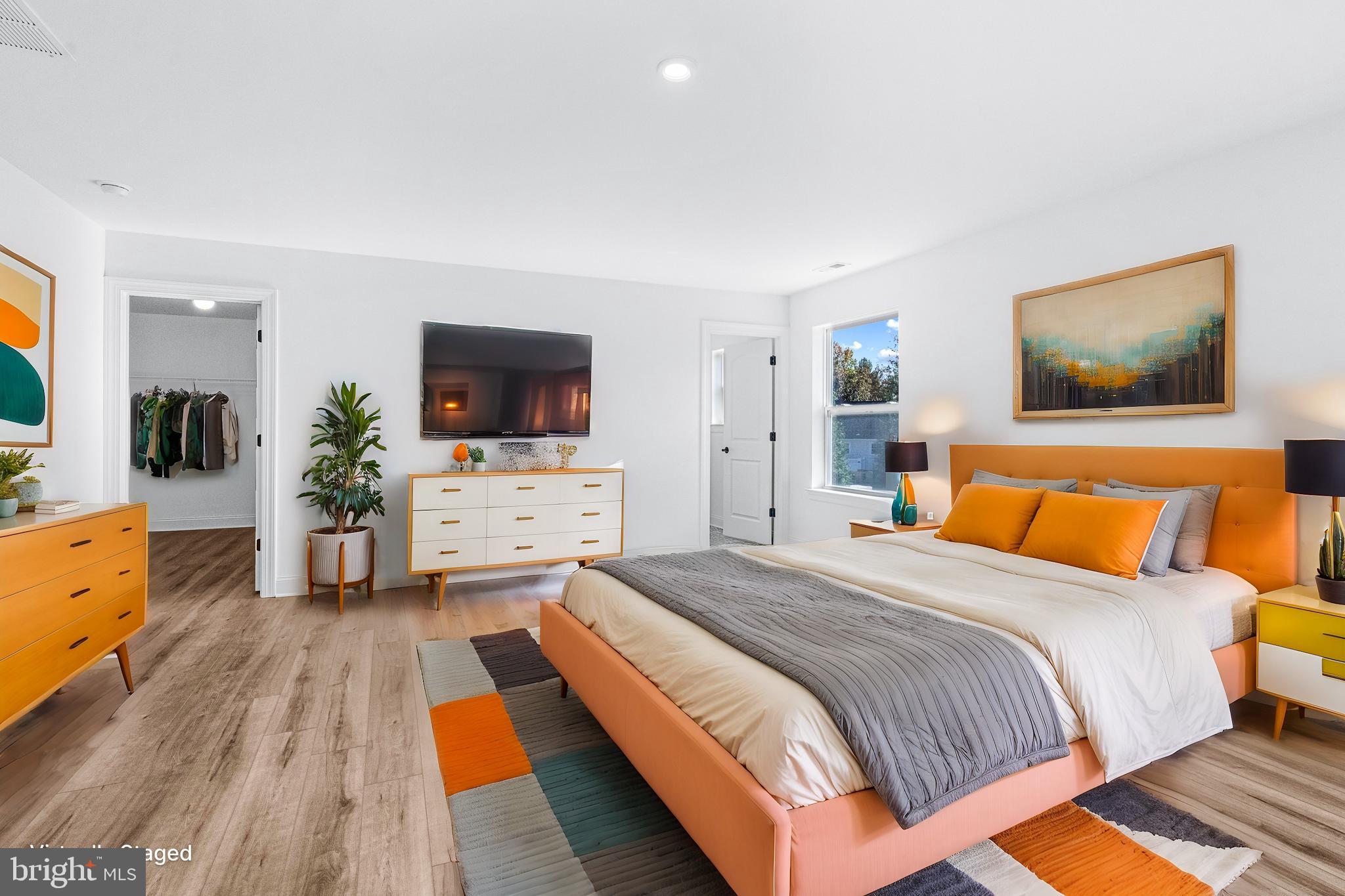 147 A Rocktown Road Ringoes, NJ 08551 - Photo 24 of 49 a spacious bedroom with a bed and a flat screen tv