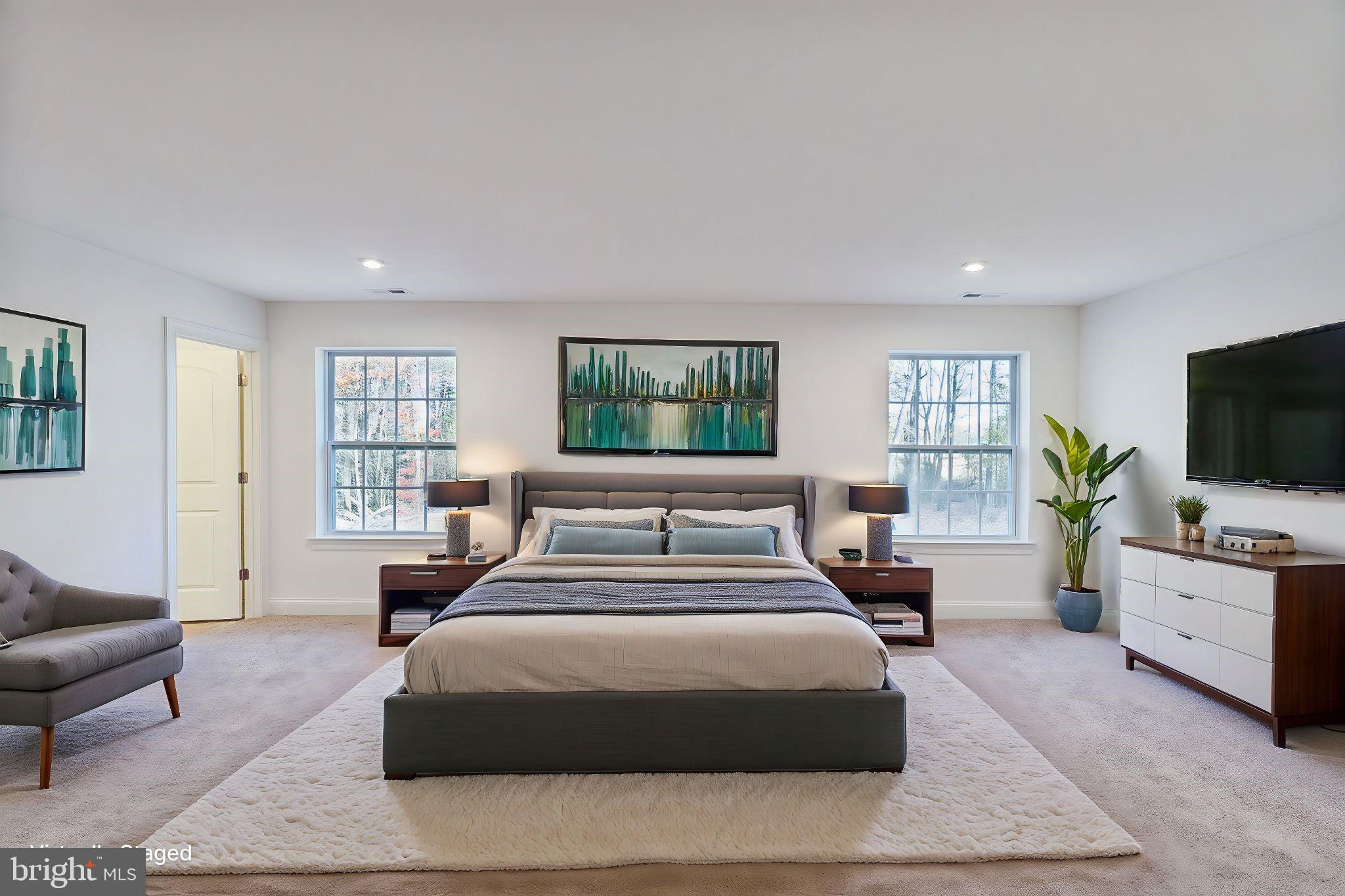 147 A Rocktown Road Ringoes, NJ 08551 - Photo 5 of 49 a bedroom with a large bed a flat screen tv and a couch