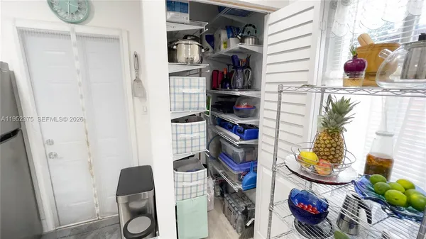 a shelf with books and knick knacks on it